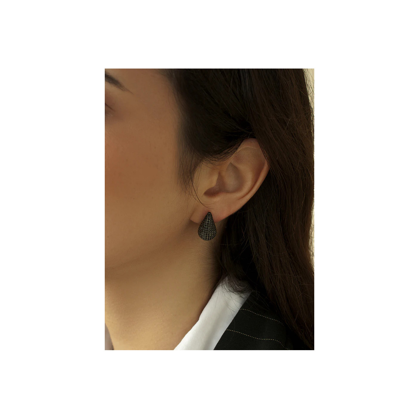 Teardrop-shaped earrings crafted from silver with black zirconia