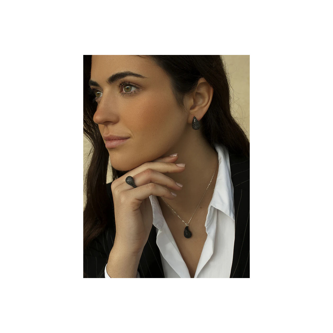 Teardrop-shaped earrings crafted from silver with black zirconia